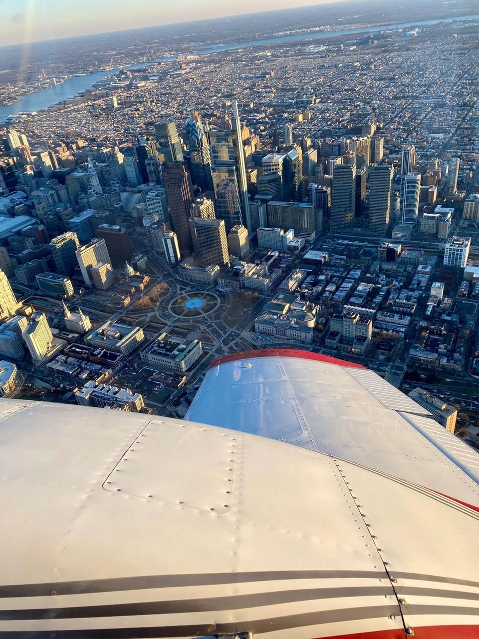 Center City Philadelphia skyline seen from the wing of a GQ Aviation airplane